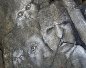 Painted stone faces - a certain bitterness