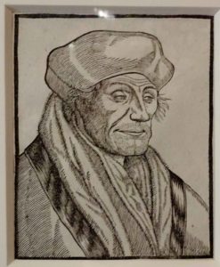 Erasmus House: Etching of a sly looking Erasmus