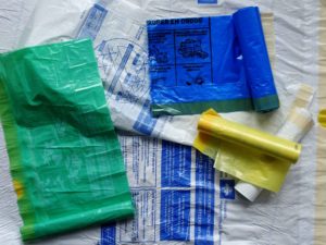 Little brown bag - White green yellow blue plastic rubbish bags