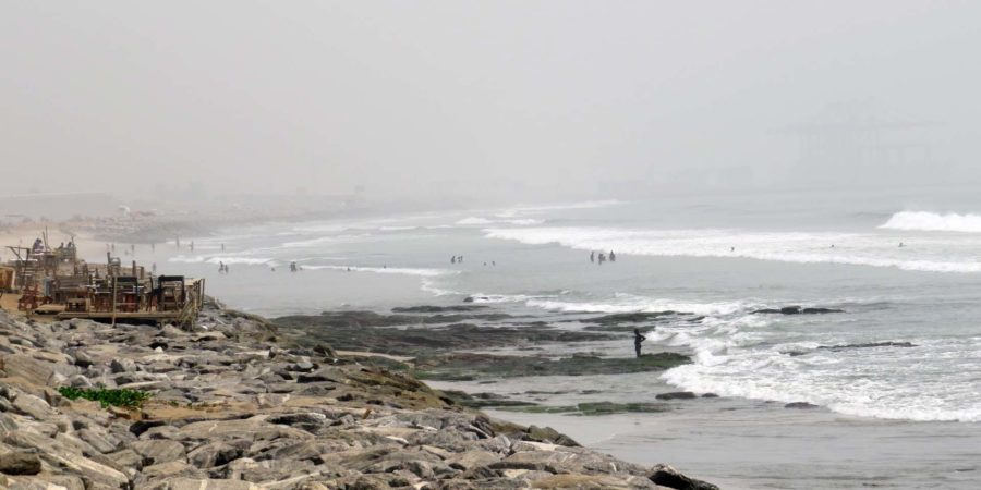 Ghana memories: Tema beach looking back towards Tema Harbour through the Harmattan haze