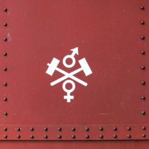 Symbol of the Bergslags Järnväg on the side of a heritage carriage