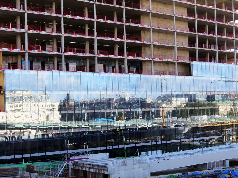 July in photography - Reflecting windows going up on the new building beside the new bridge over Göta Älv