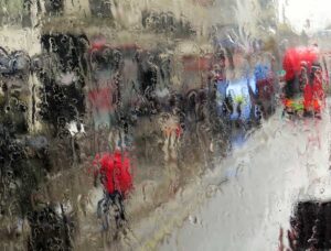 London in the rain - the rain-distorted view from the upper deck of a London bus.