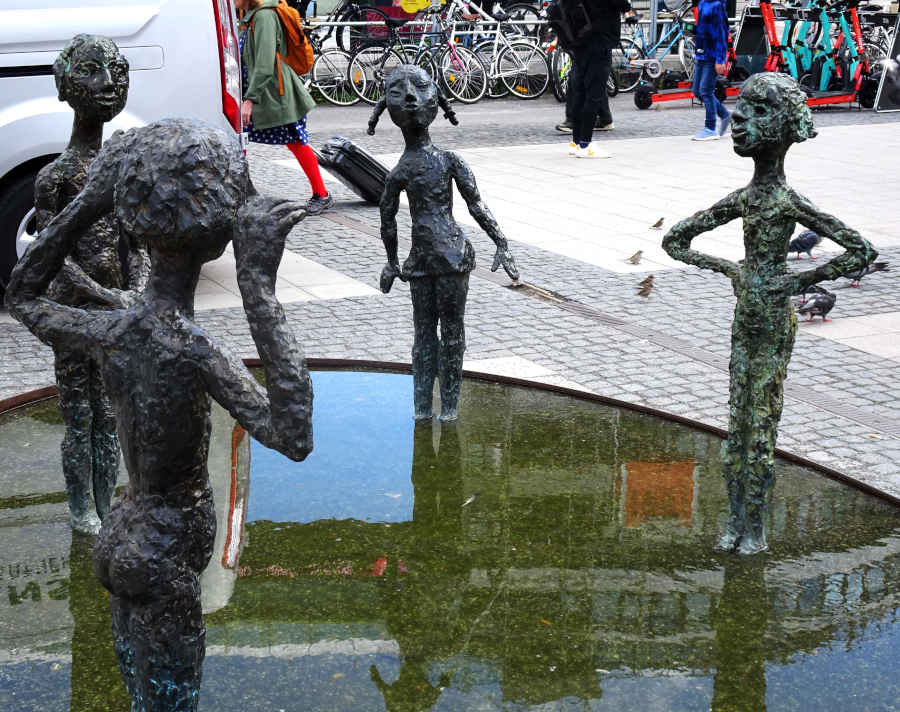 Sculpture of children playing around a pond outside the Slussen metro station in central Stockholm
