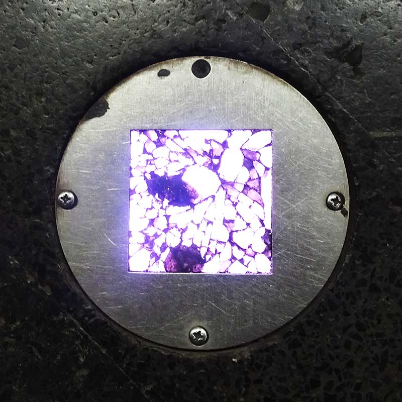 Apparently an image of shattered glass is actually an image of pebbles pasted over the glass of a bright light in the floor of the Ostermalm metro station in Stockholm